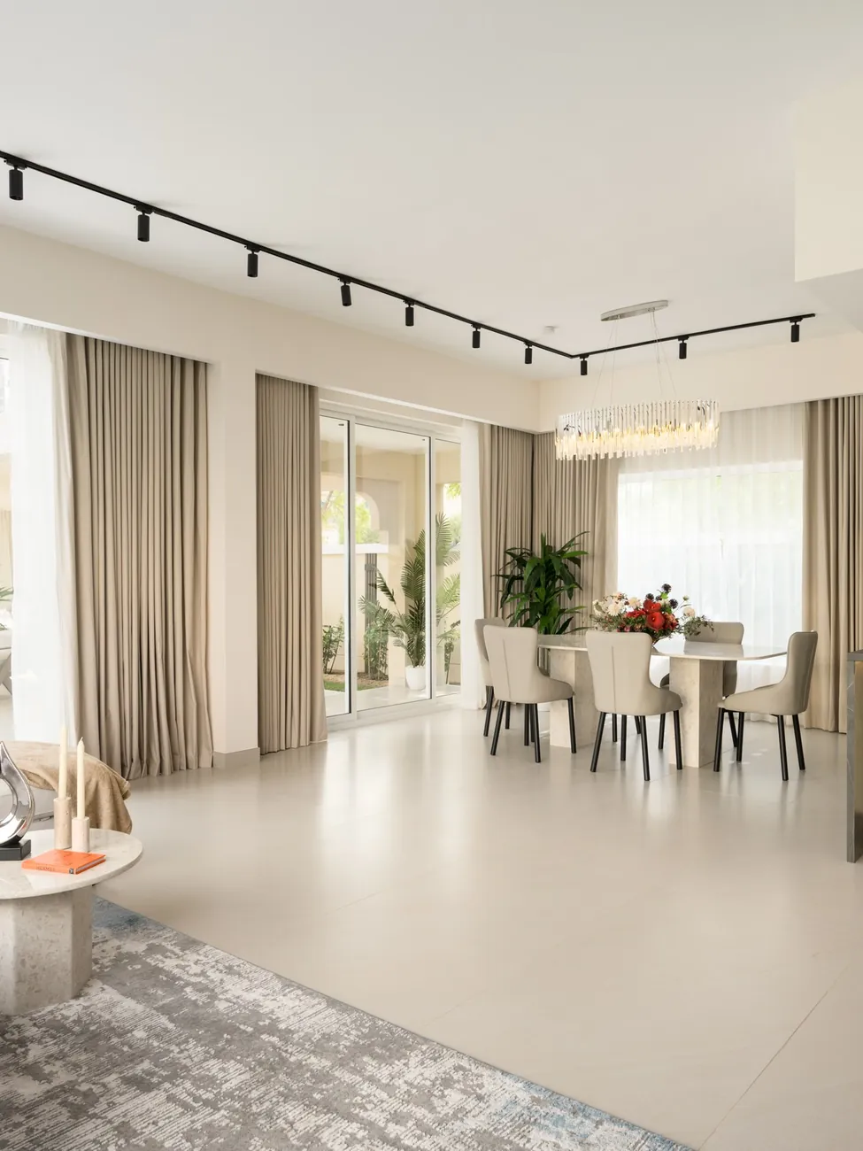 Villa living and dining area with garden view, Jumeirah Village Triangle